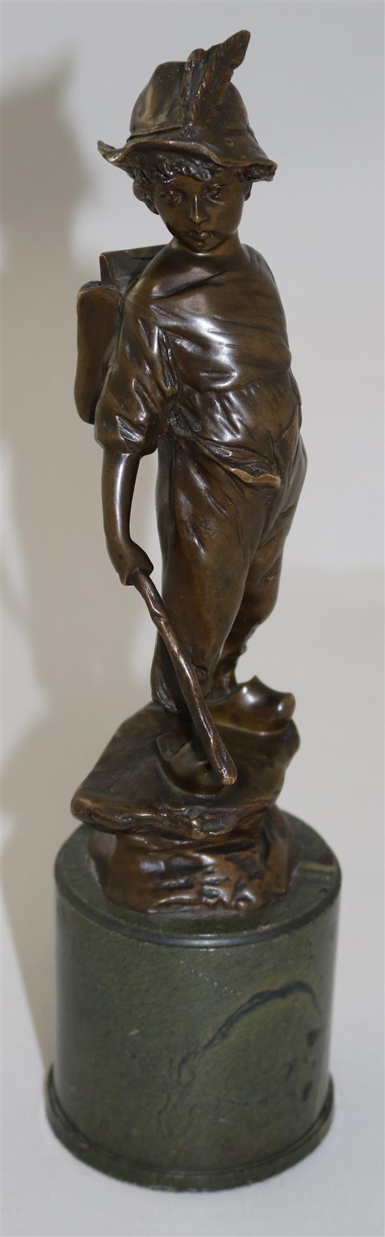 Paul Ludwig Kowalczewski (German, 1865-1910). A bronze figure of a boy wearing a backpack, overall H.11in.